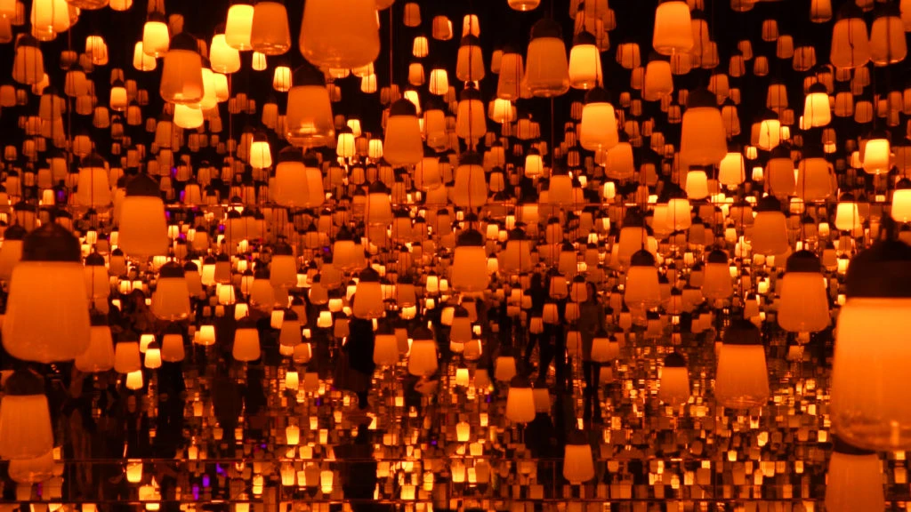 An endless room filled with large hanging lights