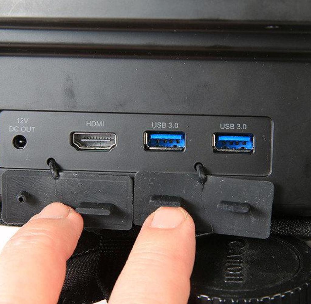 The top-mounted connectors (power supply, one HDMI and two USB 3.0) are protected by a waterproof cover