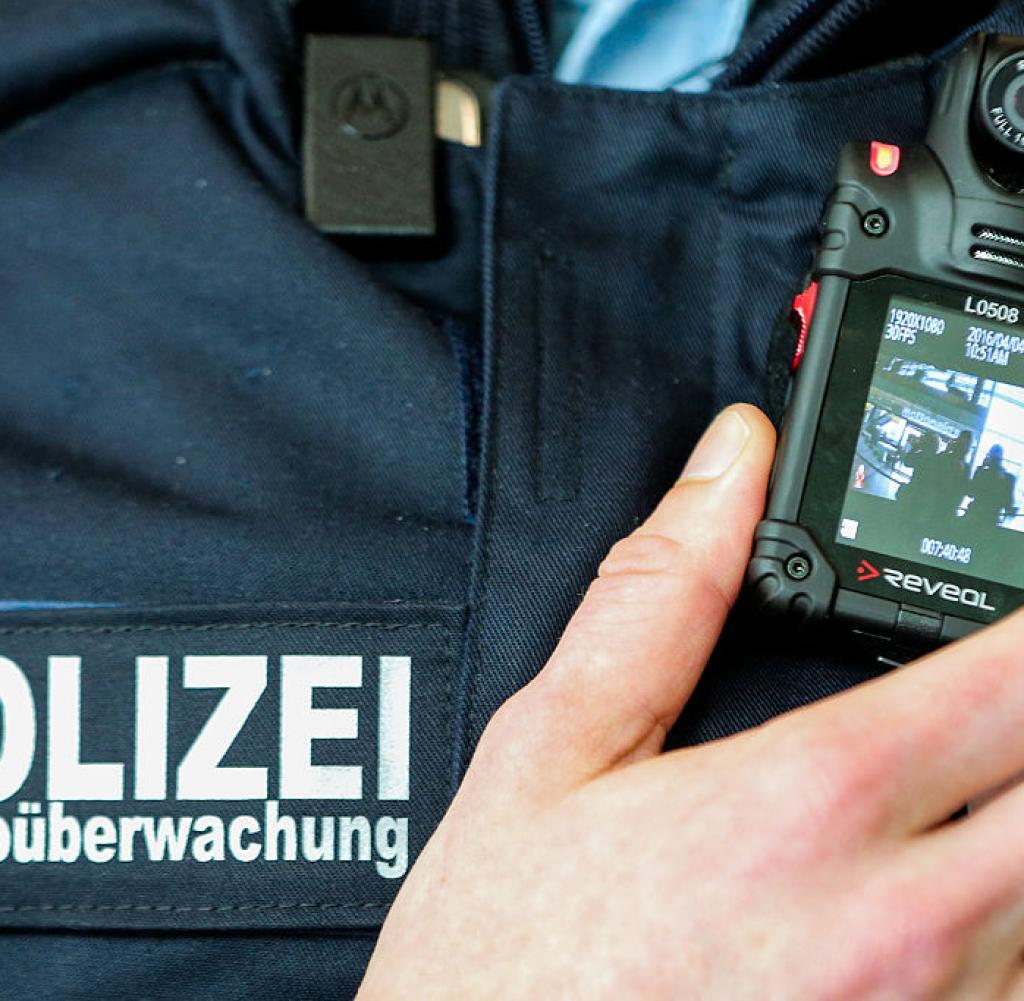 A policeman at Berlin's Ostbahnhof shows his bodycam
